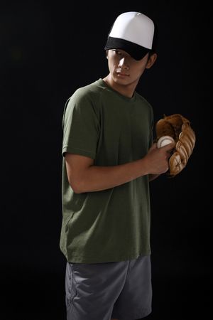 Man with baseball and baseball gloveの写真素材
