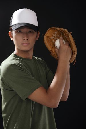 Man with baseball and baseball gloveの写真素材