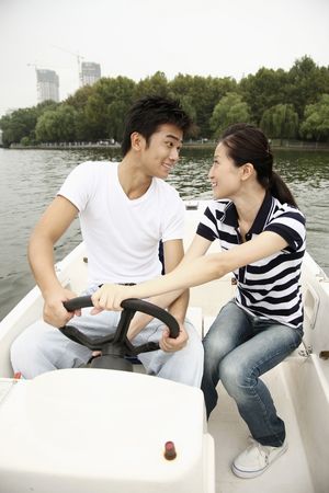 Man and woman traveling on the boatの写真素材
