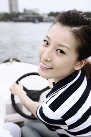 Woman traveling on the boatの写真素材
