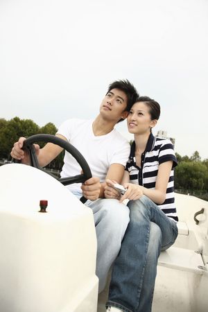 Man and woman traveling on the boatの写真素材