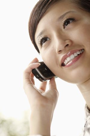 Woman talking on the phone, smilingの写真素材