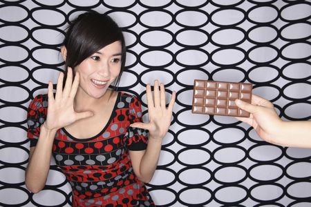 Woman excited seeing chocolate barの写真素材