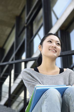 Woman smiling while looking awayの写真素材