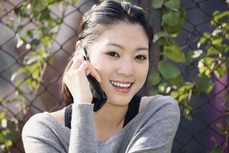 Woman talking on the phoneの写真素材