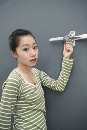 Woman checking out a padlockの写真素材