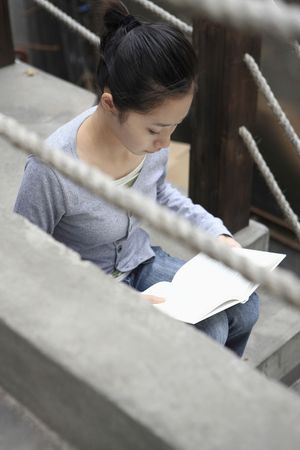 Woman reading a bookの写真素材
