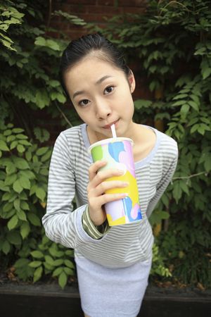 Woman drinking sodaの写真素材
