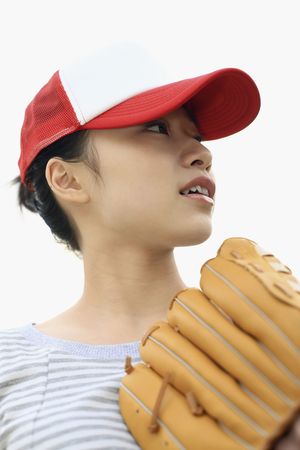 Woman with cap and baseball glovesの写真素材