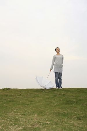 Woman holding an umbrellaの写真素材