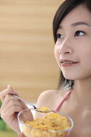 Woman holding a bowl of cereal