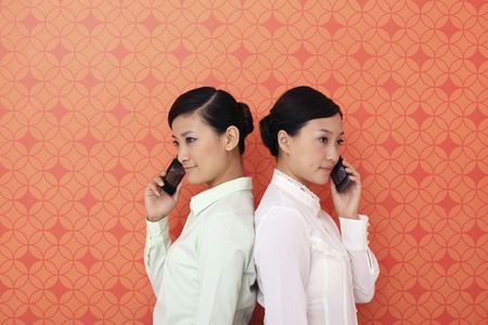 Young women talking on the phoneの写真素材