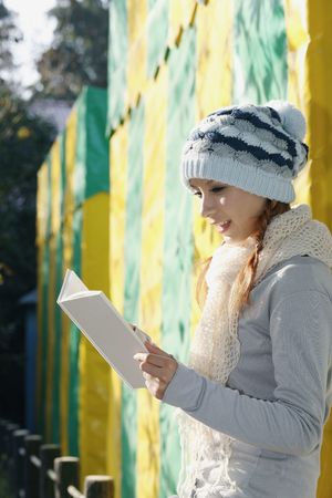 Woman reading book, smilingの写真素材