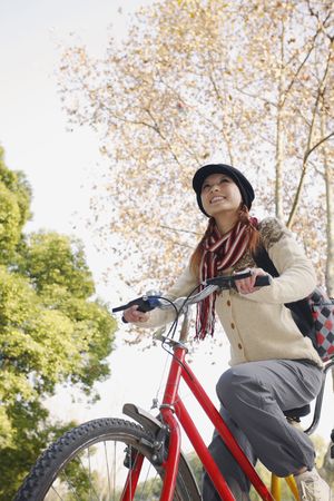 Woman riding tandem bicycleの写真素材
