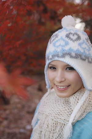 Woman wearing knit hat smilingの写真素材