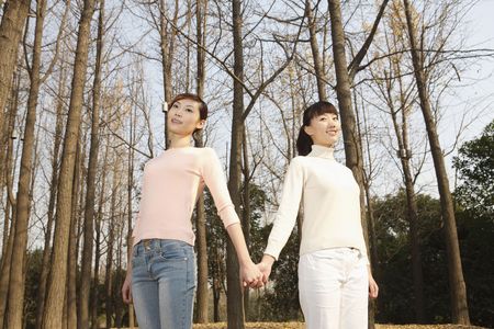 Women holding handsの写真素材