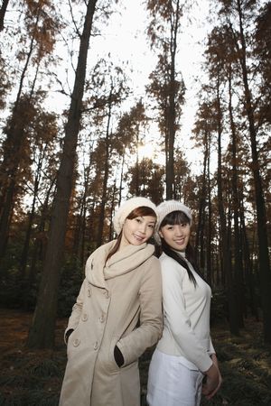 Women in warm clothing posing and smilingの写真素材