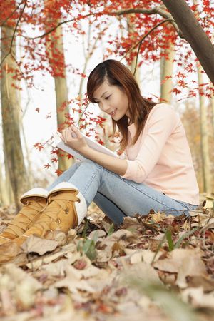Woman reading bookの写真素材