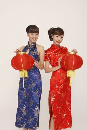 Women in cheongsam holding lanternsの写真素材