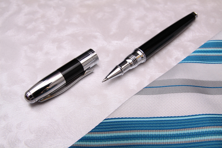Business pen and tie composition backgroundの写真素材