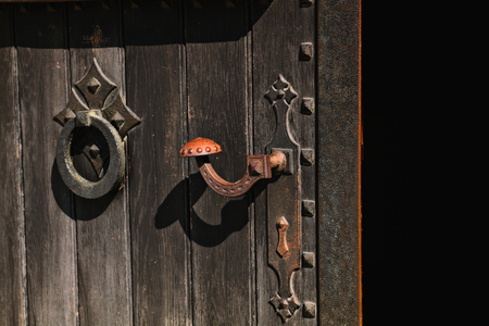 Medieval door lock photo - open old doorの写真素材