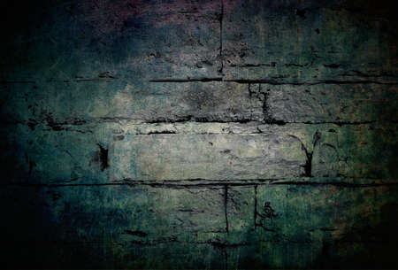 Stone brick wall in dark grunge style for modern graphic design blank backgroundの写真素材