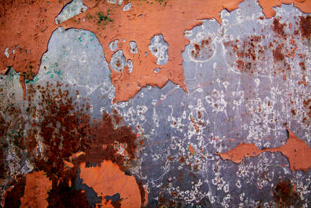 Metal rust on metal wall with rust stains, scratches and leftover color. Old metal backgroundの写真素材