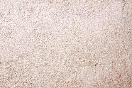 Outer white wall of grainy plaster on old houseの写真素材