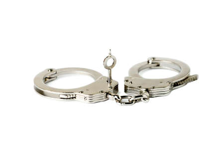 handcuffs with key on white background