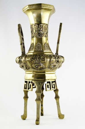 Chines bronze figurine on a white background.の写真素材