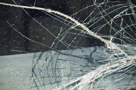 Broken windshield that looks like a spider webb.の写真素材