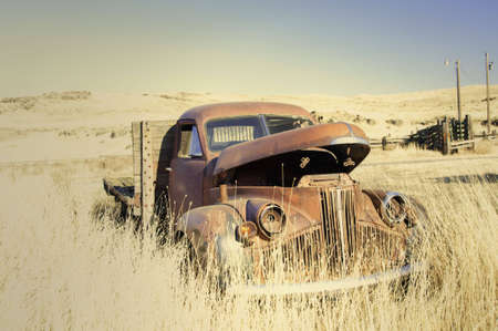 High key photo of old studebaker flatdeck in farm field in palouse area.の写真素材