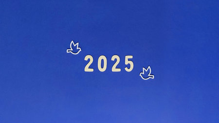 Happy new Year 2025 backdrop, blue paper background with white numbers and silhouette of birds