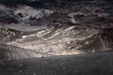 Walking on the edge of Ubehebe Crater in Death Valley Nevadaの写真素材
