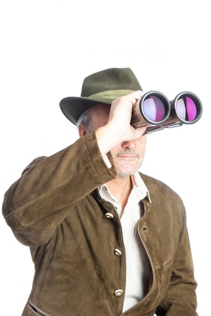 elder german hunter searching prey with his binocularsの写真素材