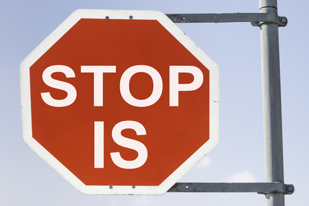 red stop sign with the words stop IS. Concept for: Stop the IS or stop entering Islamic Stateの写真素材