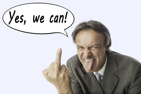 elder mad business man in a grey suite poking oneÂ´s tongue and showing his middle finger. In a speech balloon are written the words: Yes, we can. Concept for anger, stress and bad service.の写真素材