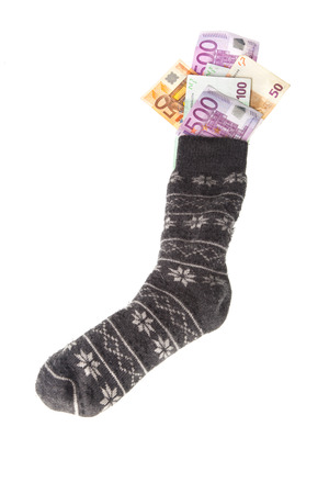 gray sock with money euro banknotes. Financial concept for savingの写真素材