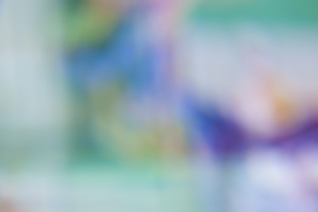 blurred soft colorful background in green blue violet pink orangeの写真素材