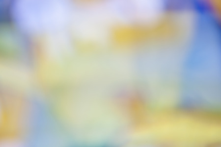 blurred soft colorful background in yellow green red orange blueの写真素材