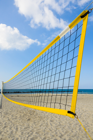 yellow volleyball net at the beach of the german baltic sea, concept for summer vacation and sport; Germany, Europeの写真素材