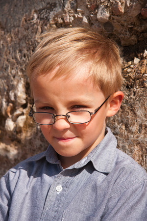 Happy and smiling little boy on a tripの写真素材