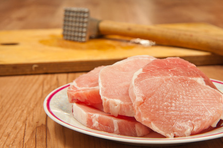 Pork chops ready to be fried.の写真素材