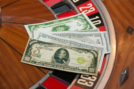 The pile of dollars notes on the roulette.