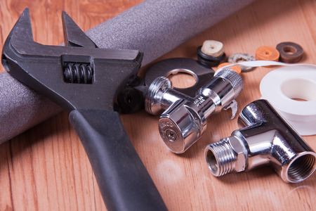 Professional plumbing tools and seals placed in the workplace.