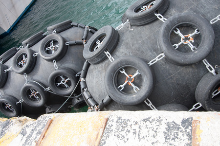 A huge mooring buoy at the waterfront of a sea portの写真素材
