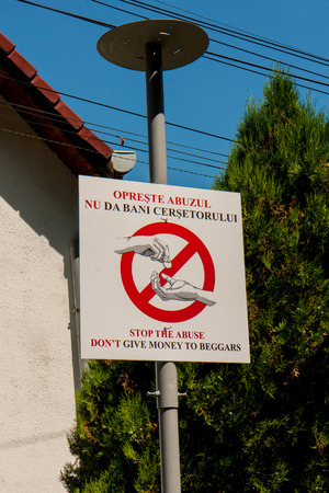 The Visitors information board  in front of the old town, which prohibits beggingの写真素材