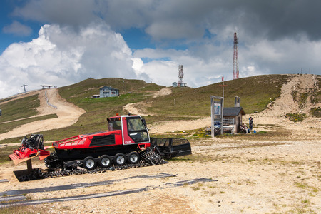 Renovated snowmobile waiting for the winter next to the ski liftのeditorial素材