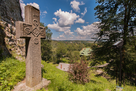 Bran, Romania - July 05, 2015: Stone cross at the entrance to the castle of Draculaのeditorial素材