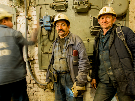 Ruda Slaska, Poland - November 05, 2015:  Employees of a coal mine wearing working clothes and waiting for an elevator.のeditorial素材